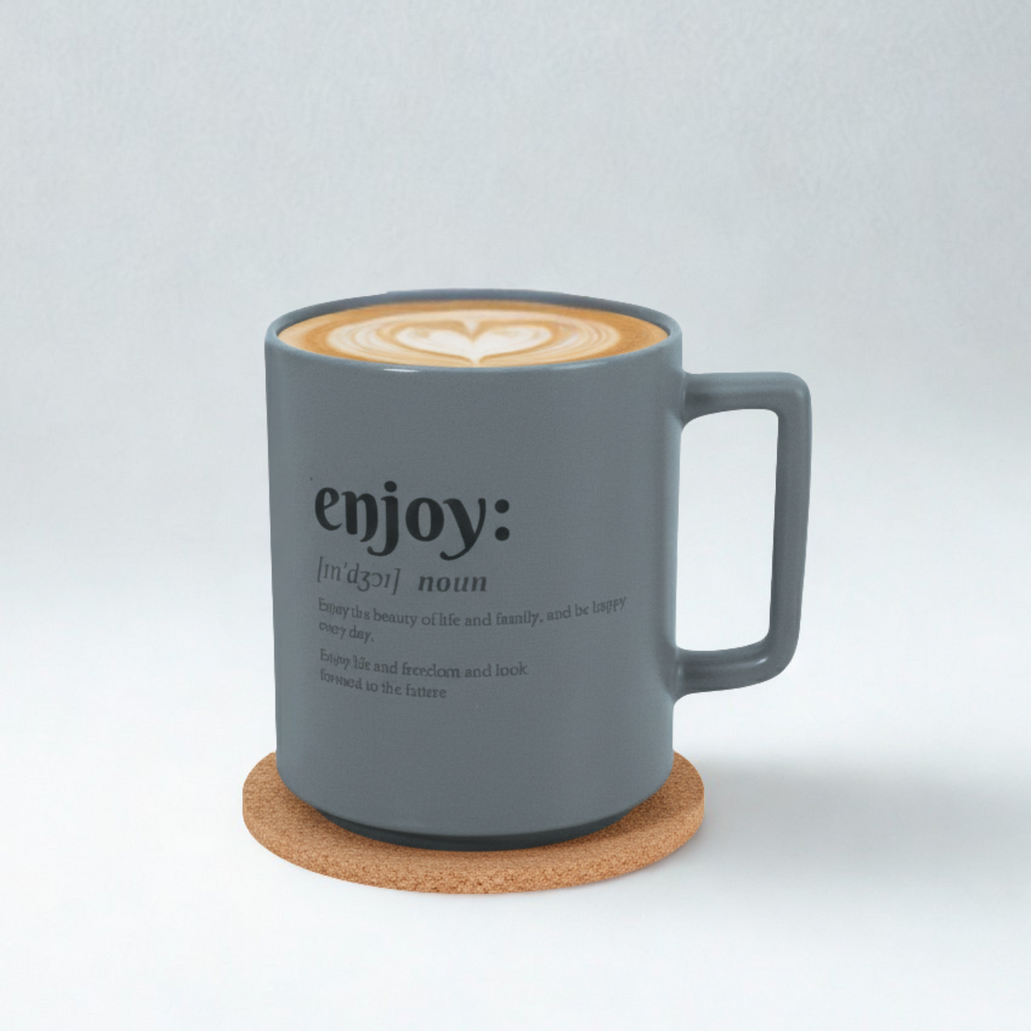 Gray mug with 'enjoy' text and latte art on a white background