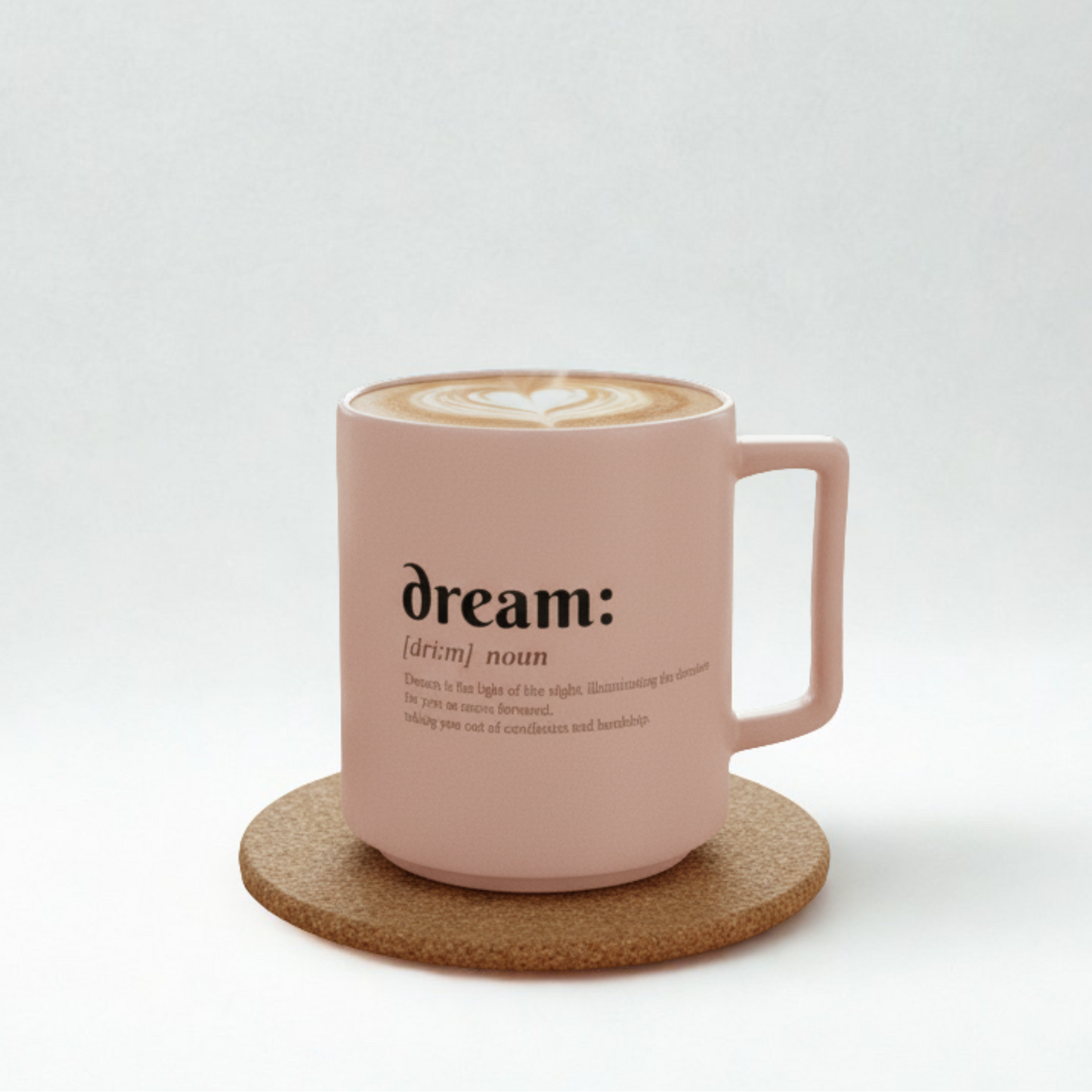 Pink mug with 'dream' definition text on a white background