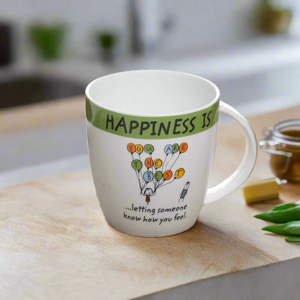 Mug with motivational quote on a kitchen counter